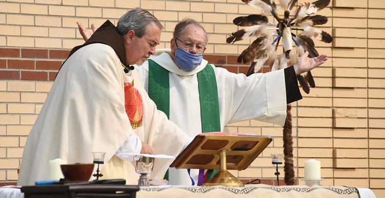 Friars Jim Antoine, OFM Cap. (R) and Larry Webber, OFM Cap. (L) celebrate Mass at St. Labre. Photo: Jack Ballard