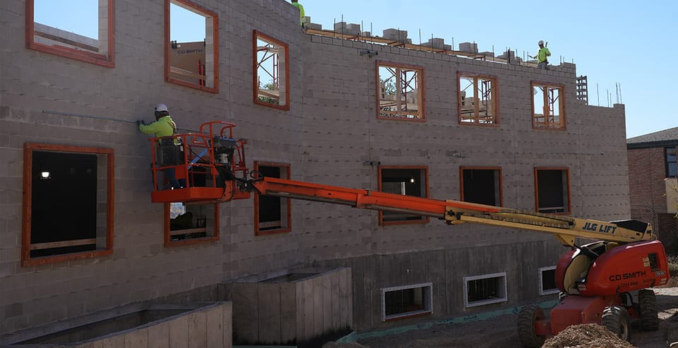 Construction crews work on the exterior of Blessed Solanus Casey Hall. Photo Credit: Kevin Buelow/St. Lawrence Seminary